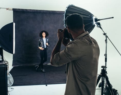 Photographer Doing A Photo Shoot In A Studio